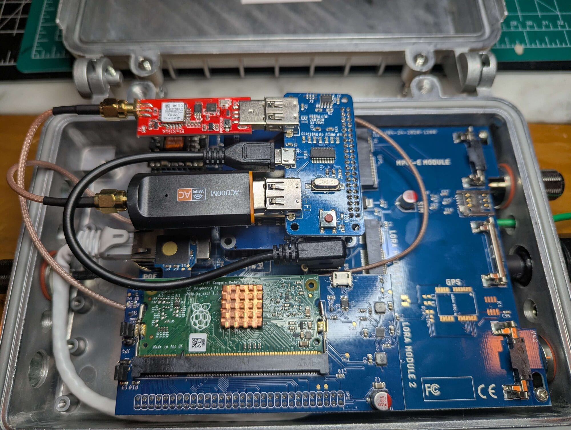 A dual-radio build: a ZebraHat plus a prototype USB Meshtastic radio.