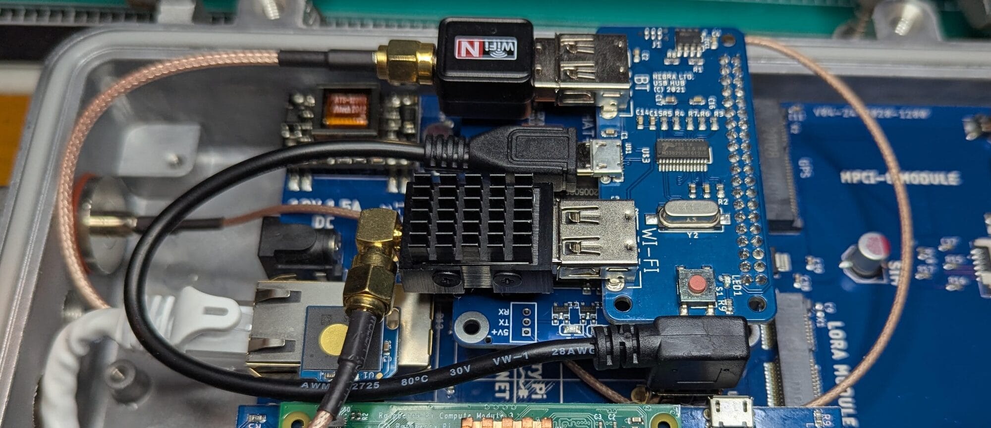 A NooElec NESDR Nano 3 installed next to the hat.